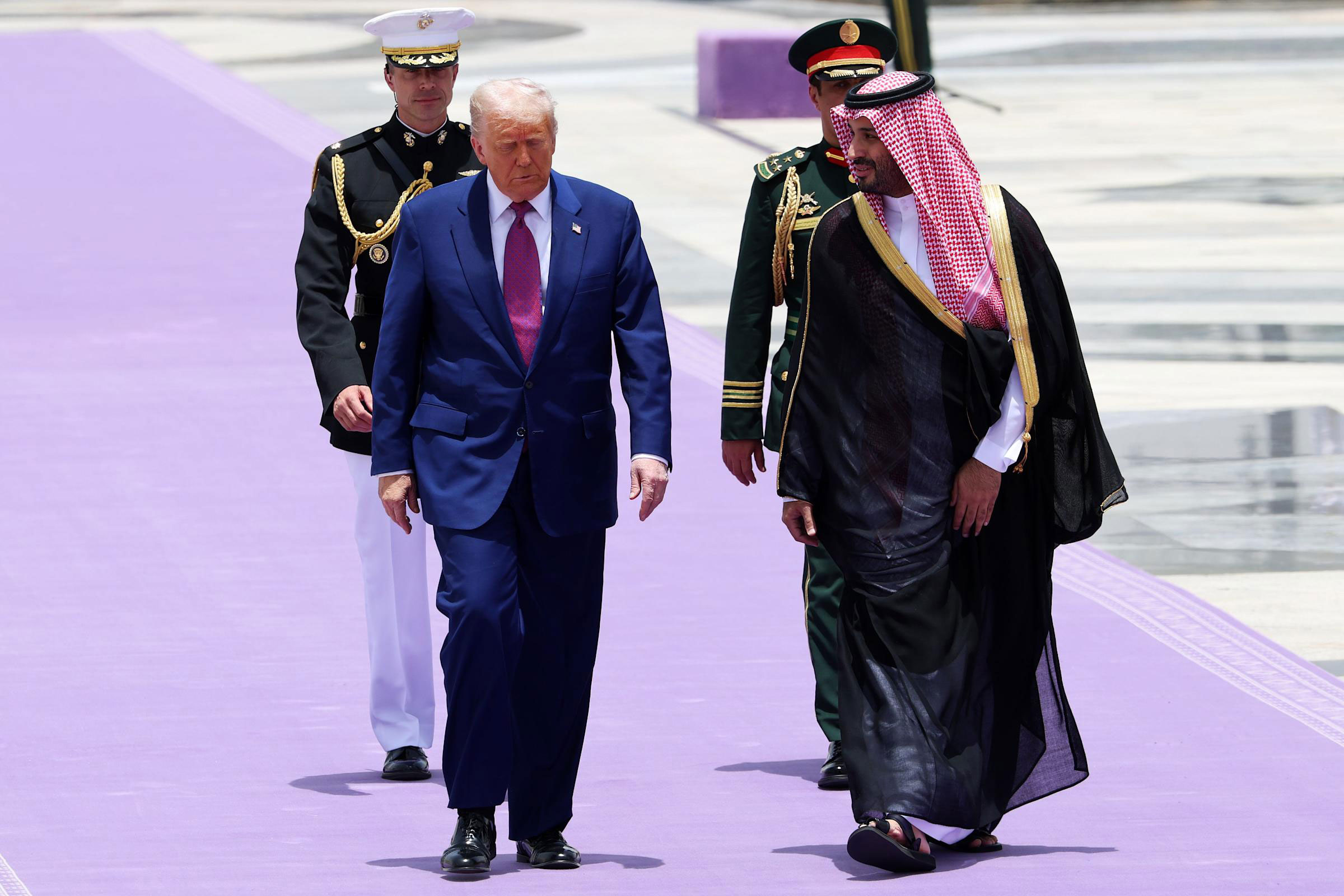 Donald Trump walking with Saudi Crown Prince during official state visit in 2025, impacting global oil and gas logistics discussions.