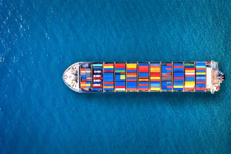 Global shipping from US and Canada – aerial view of cargo ship at sea